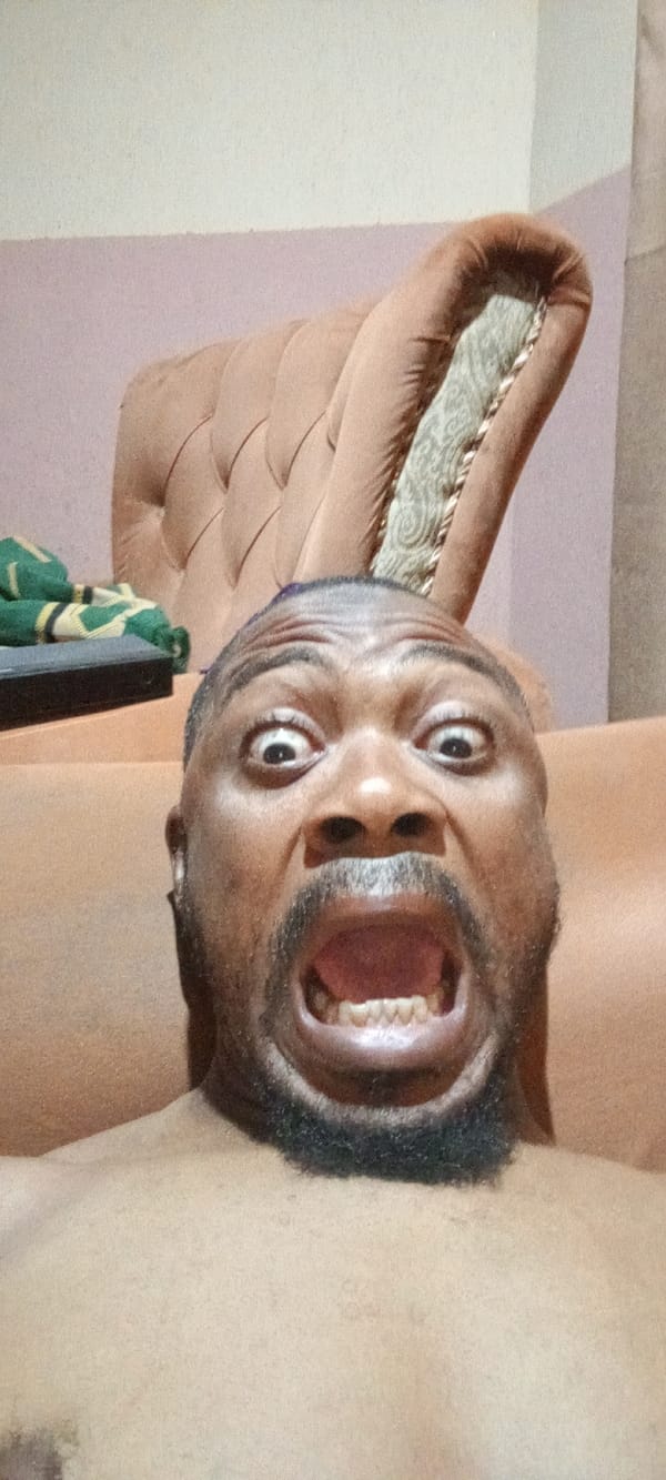 Man makes dramatic facial expression for camera in Nigeria