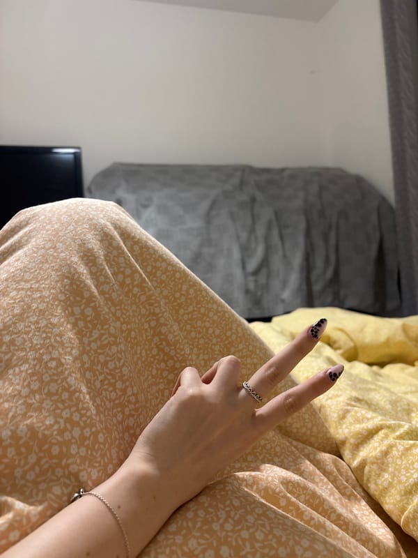 Peace sign gesture observed in Sofia with decorative nails