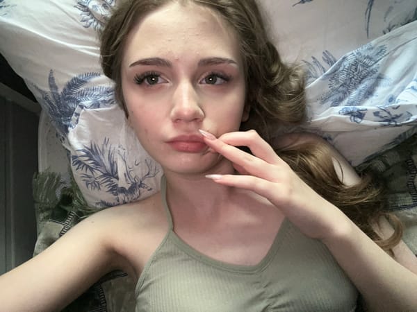 Lazy afternoon selfie session on patterned bedding in Ashkadar