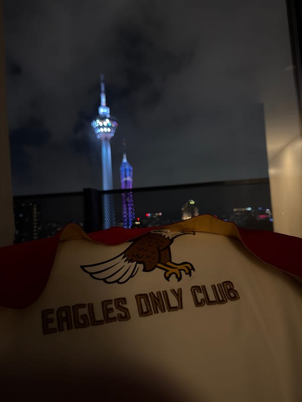Nighttime KL: city lights, iconic towers, street-level scenes