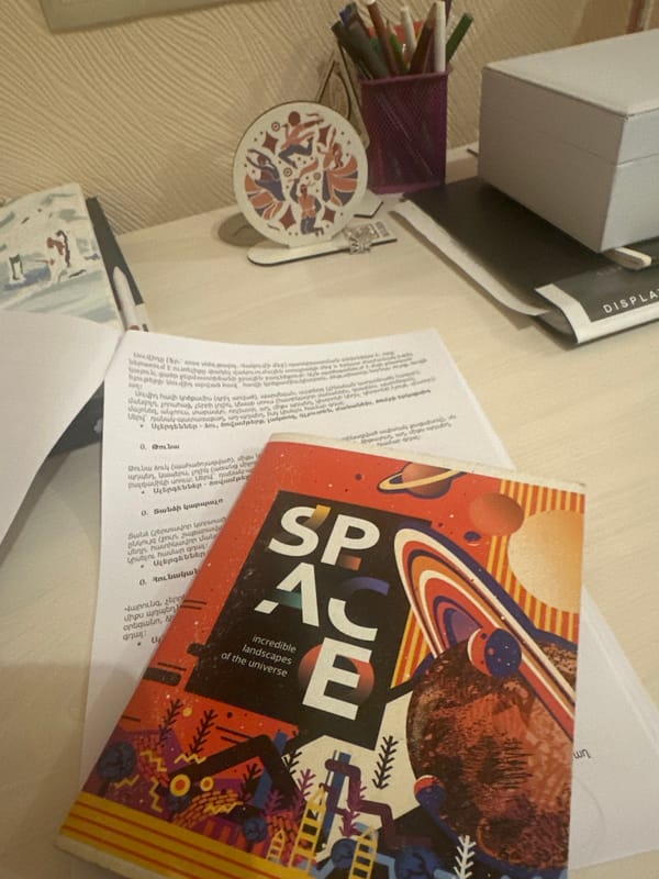 Space book spotted on cluttered desk surface