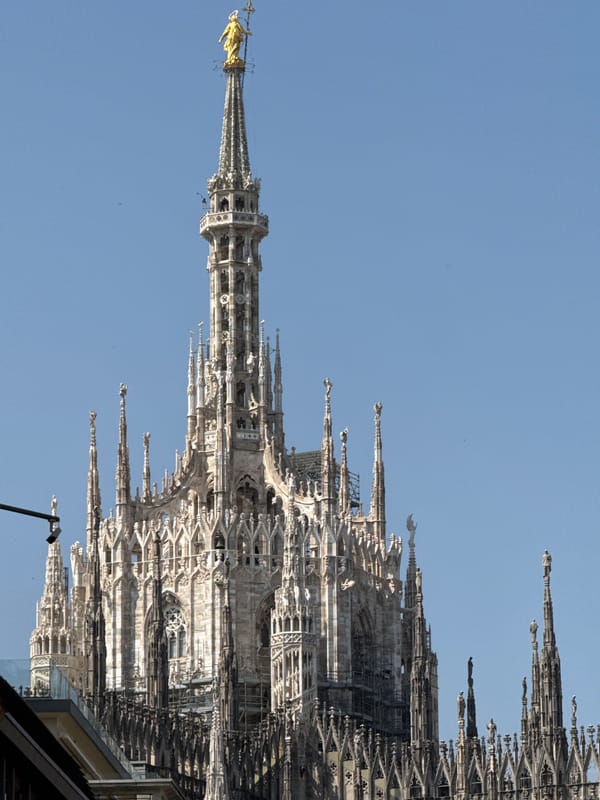Tourist documents morning activities across Milan including Duomo, shopping, dining