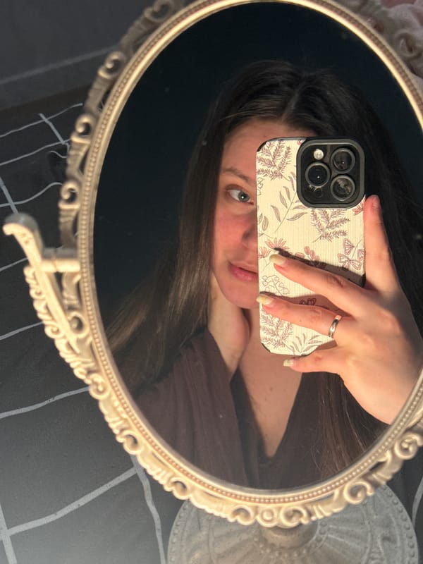 Person takes multiple mirror selfies in Krasnodar home