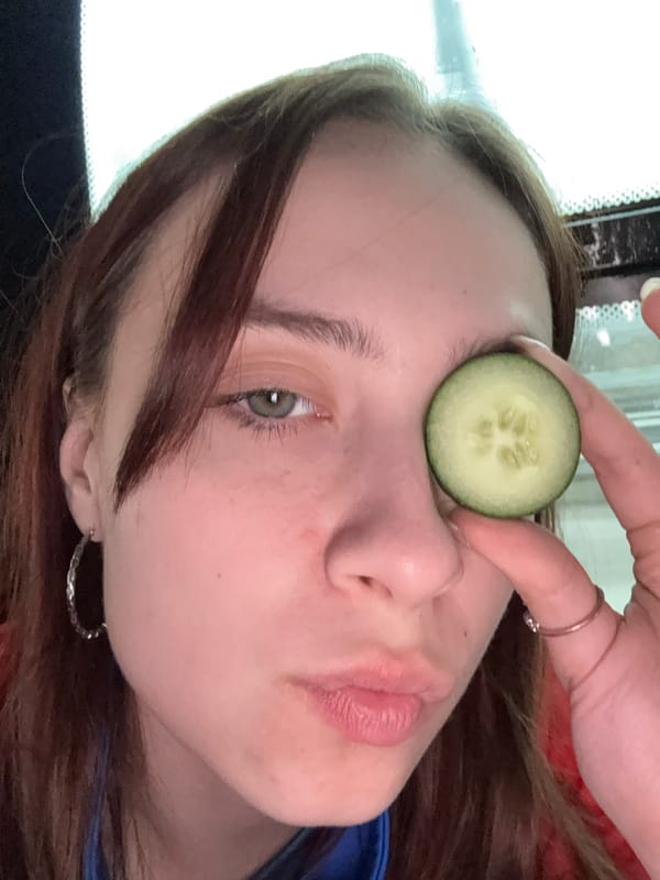 Woman poses with cucumber slice over eye in Yanychi