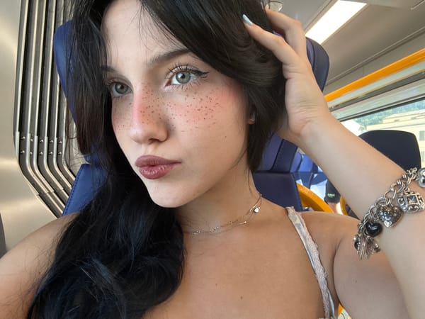 Selfie moment aboard a train rolling through coastal Italy