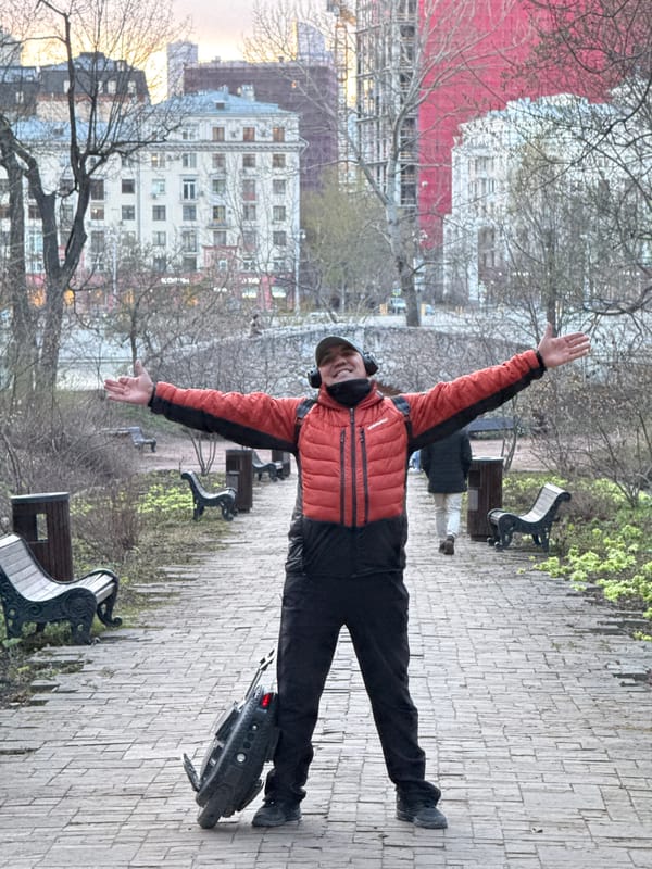 Electric unicyclist celebrates along Moscow river embankment
