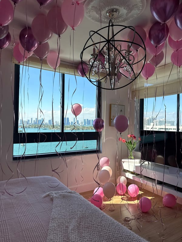 Miami Beach room decorated with pink purple balloons