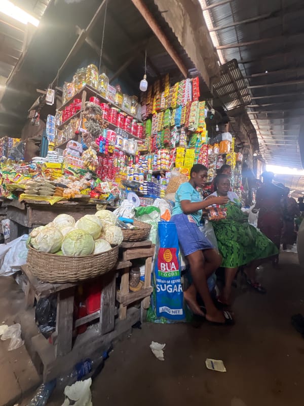 Market workers rest on sugar sacks in Nkpor Nigeria