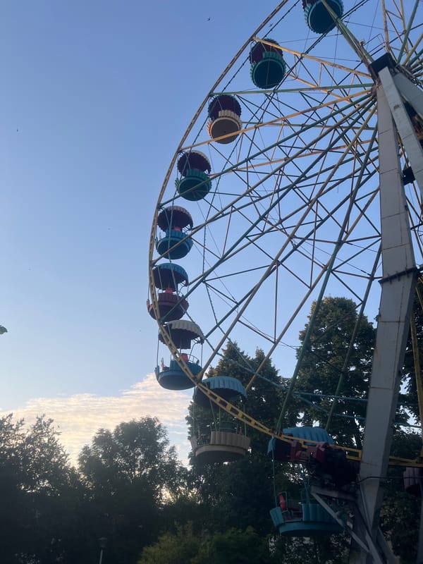 Aging Ferris wheel stands against a clear sky in Zhytomyr