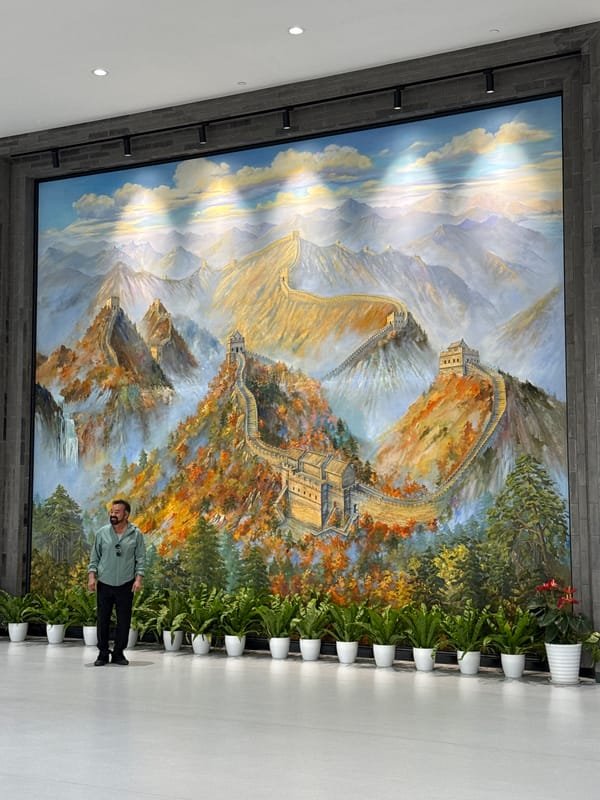 Tourists explore Great Wall visitor center with interactive displays