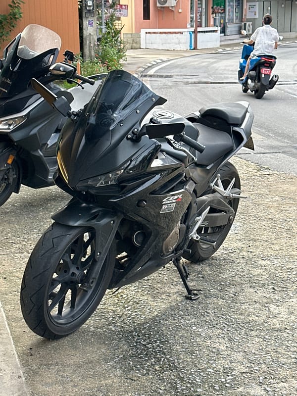 Roadside bike stop on a Karon sidewalk, Phuket
