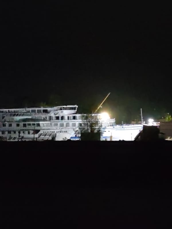 Two vessels docked at night in Kimry, Russia