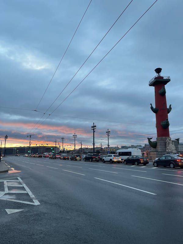 Saint Petersburg at dusk: wet streets, dancing, and a dramatic sky