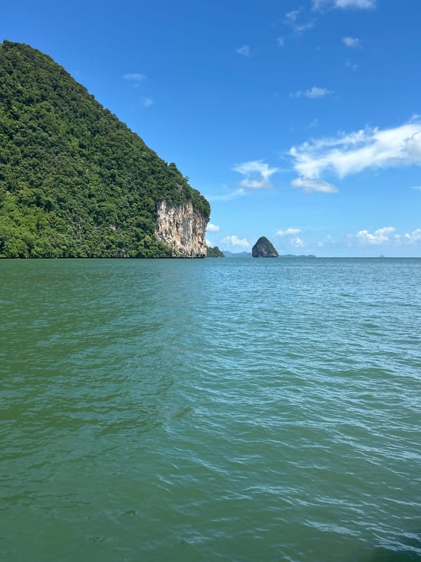 Boats and island scenery on a Thai morning at sea