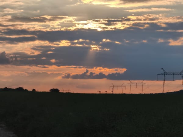 Sunset over crop fields and dirt roads in rural western Ukraine