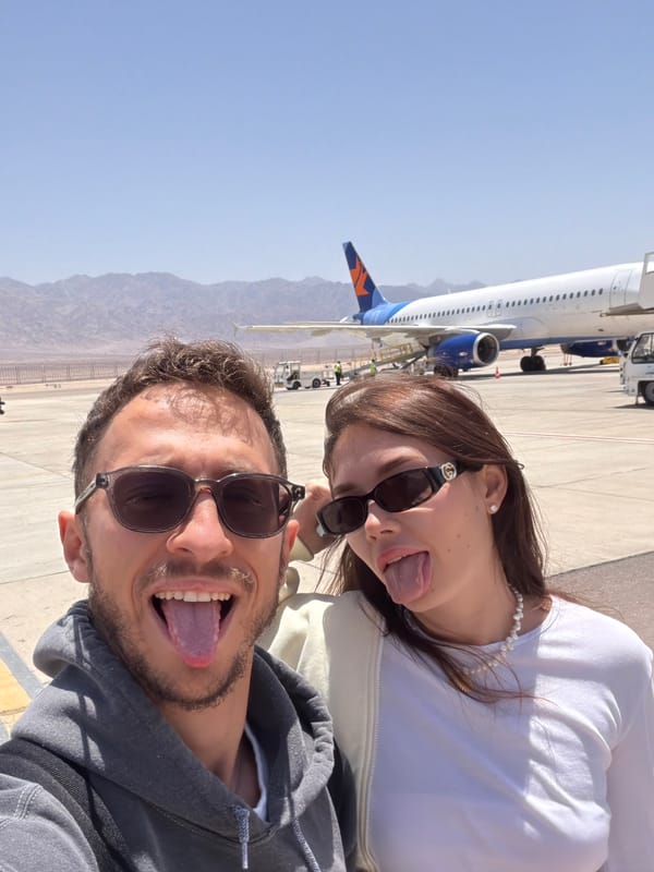 Tourists take selfies on Eilat airport tarmac