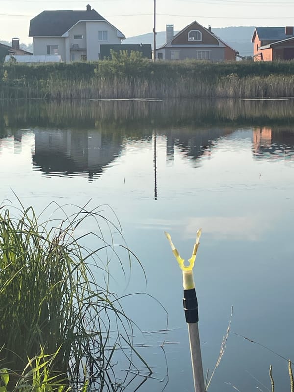 Early morning fishing session on a calm Oktyabrsky waterway
