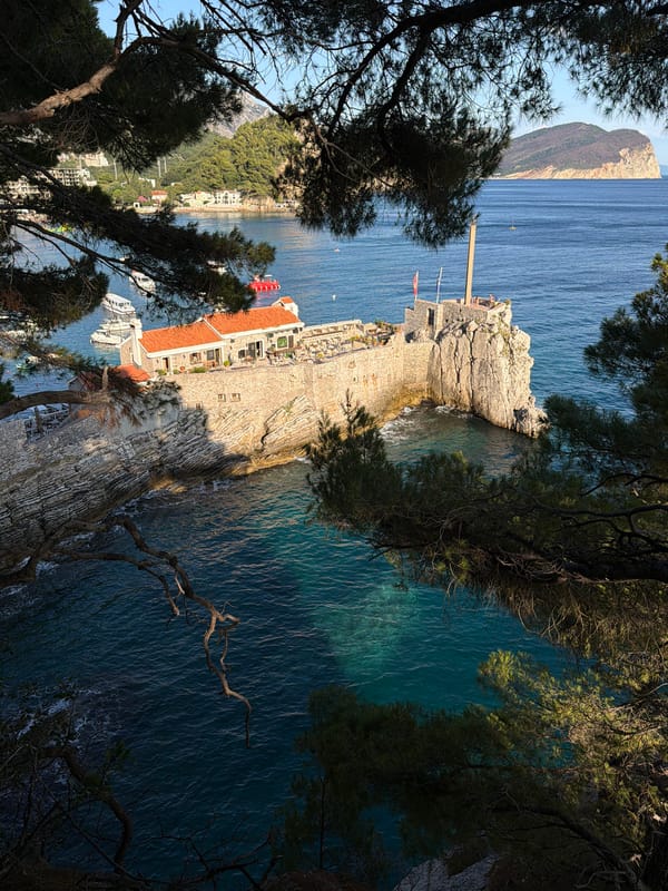 Rocky coastline and historic stone structure, Petrovac, Montenegro