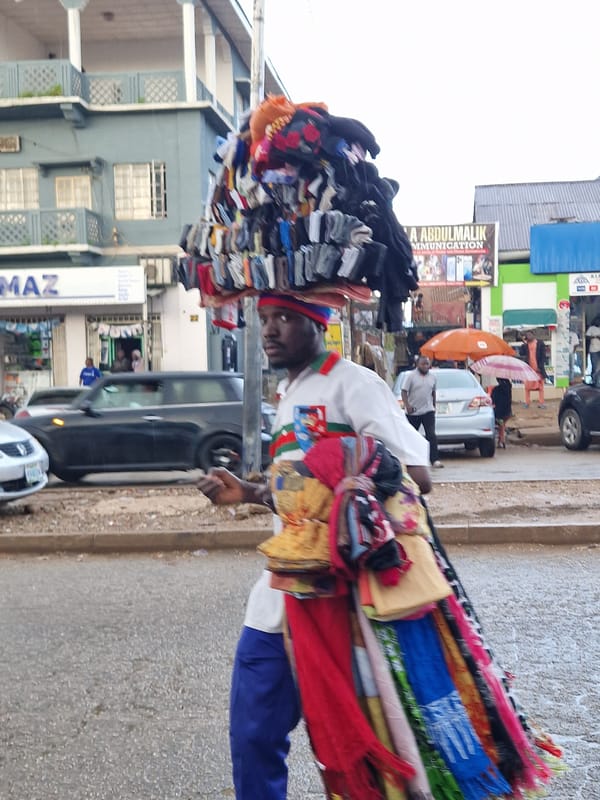 Rainy day street life in a busy West African urban market