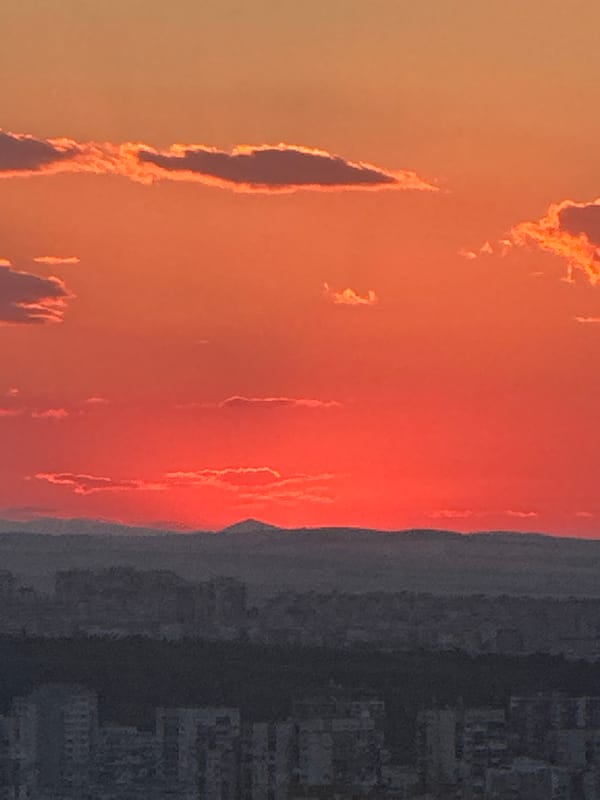 Dinner service and sunset views at a Sofia restaurant