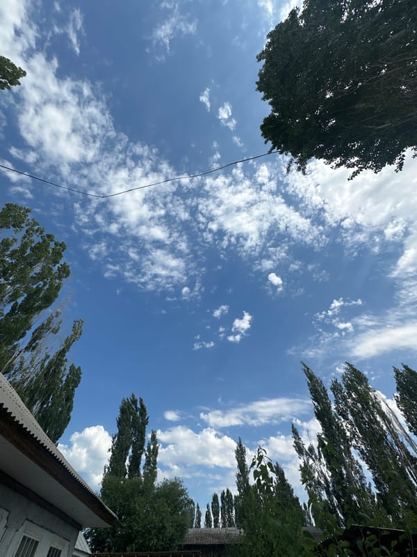 A quiet morning in Тайгараев: skies, a napping baby, parked car