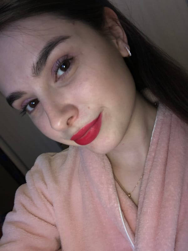 Woman takes indoor selfies in pink bathrobe in Russia