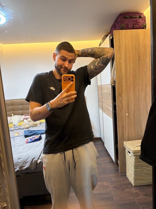 Man takes mirror selfies in athletic wear in Sofia