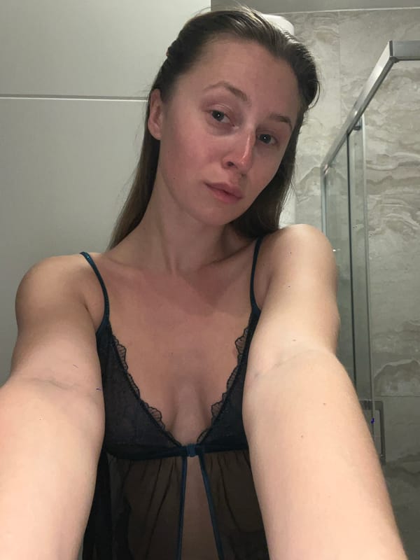 Woman photographed in bathroom setting in Bečići, Montenegro