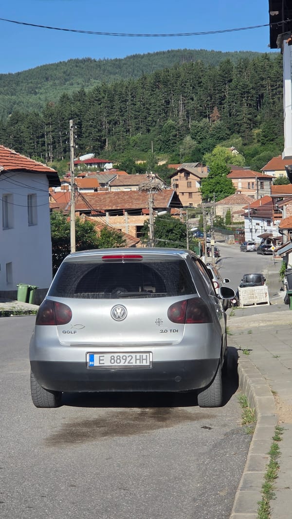 Silver VW Golf parked on a street in Bania, Bulgaria