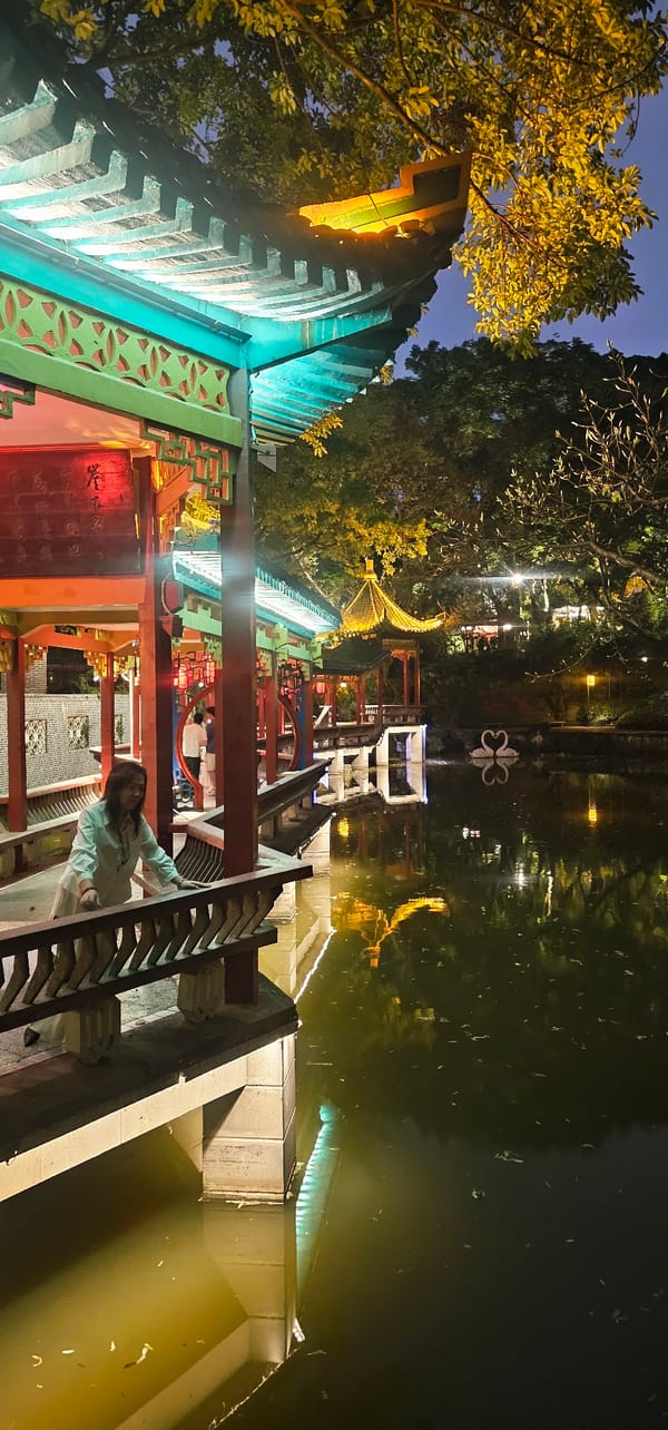 Evening stroll captured on illuminated traditional walkway in Chongqing