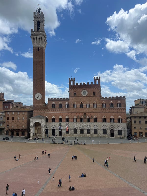 Morning street life documented across historic Siena city center
