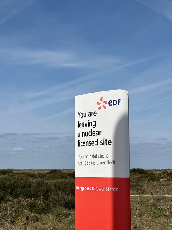 Mercedes convertible parked near sheep pastures in Kent countryside