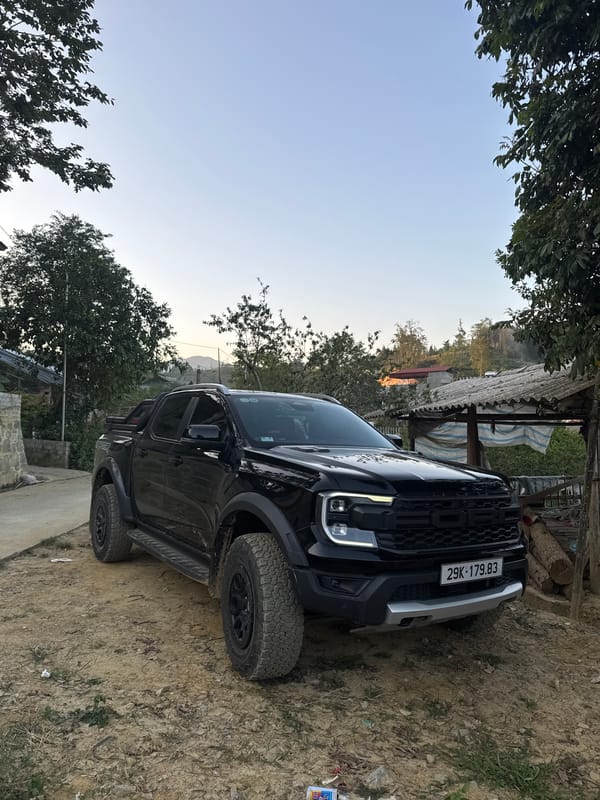 Black pickup truck parked in rural Bắc Hà Vietnam