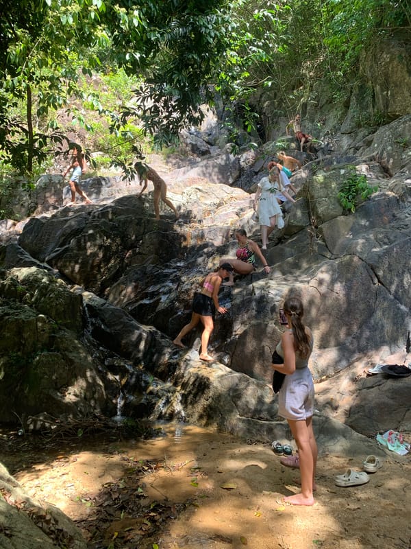 Groups exploring a jungle waterfall on Ko Samui