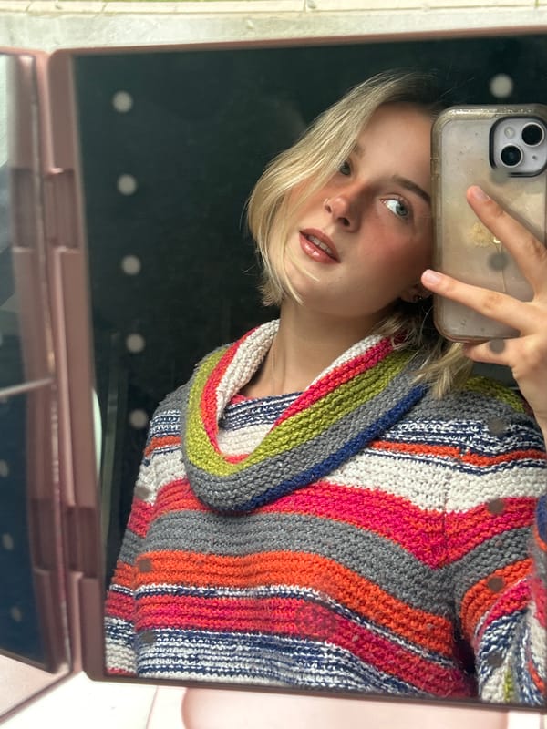 Woman takes selfies with makeup mirror in Whistler