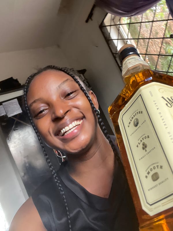 Woman poses with whiskey bottle in selfies in Lokoja