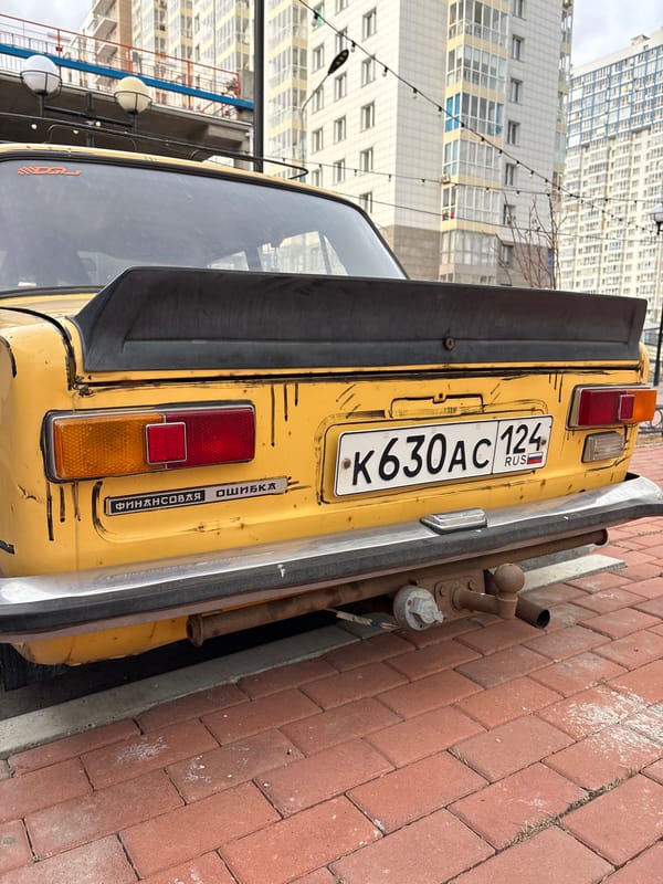 Urban scenes captured in Krasnoyarsk parking areas and residential district