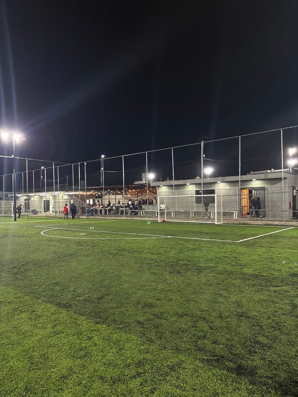 Late-night pizza and illuminated soccer field documented in Mexico