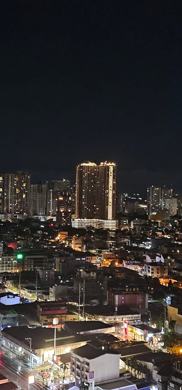 Makati at night: highways, city lights, and street activity