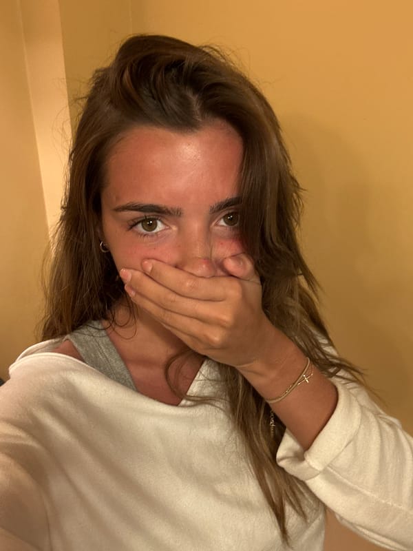 Woman photographed reading on couch in Porto apartment