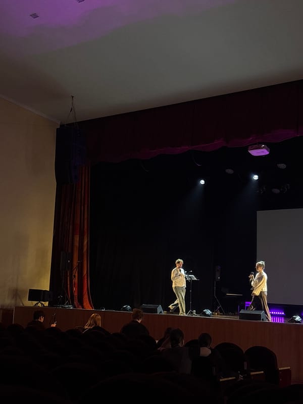 Stage performance with temperature theme message in Perm auditorium