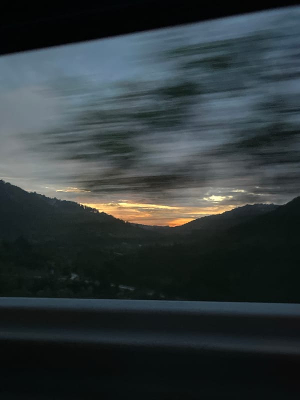 Dramatic sunset captured over Bulgarian mountains from moving vehicle