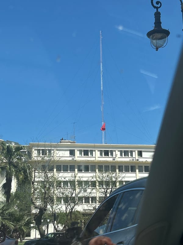 Antenna tower with red flag observed in Tangier