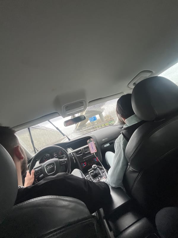 Driver navigates rainy streets in Bucharest