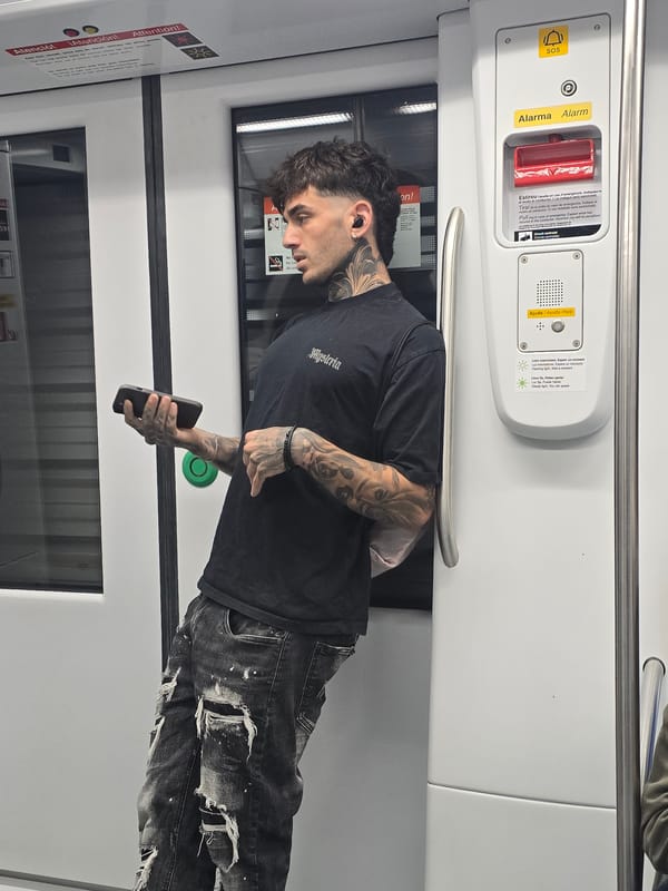 Tattooed commuter spotted on Barcelona Metro during morning rush