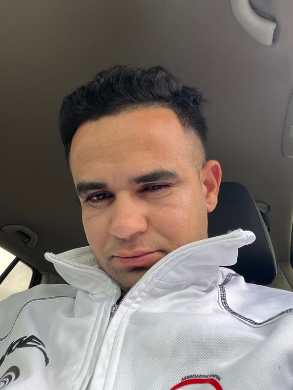 Man takes selfies inside car in Martil, Morocco