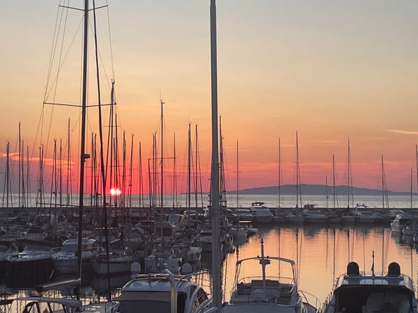 Golden hour settles over Punta Ala's marina