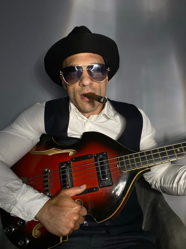 Bass guitar and cigar pose in Pleven, Bulgaria