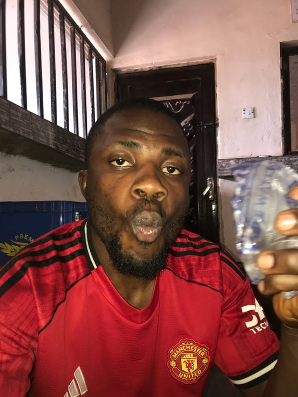 Nigerian football fans share meal, take selfies near stadium