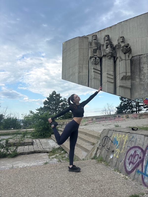 Woman practices yoga at Bulgarian-Soviet Friendship Monument in Varna